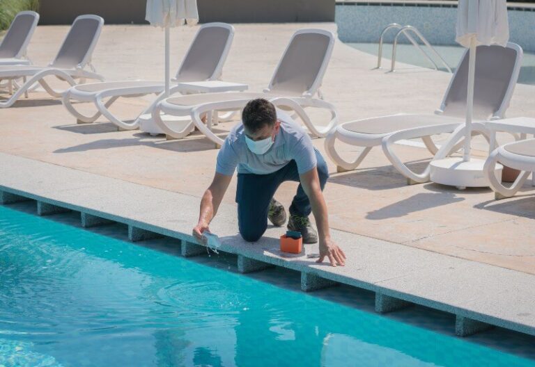 Technician performing pool inspection