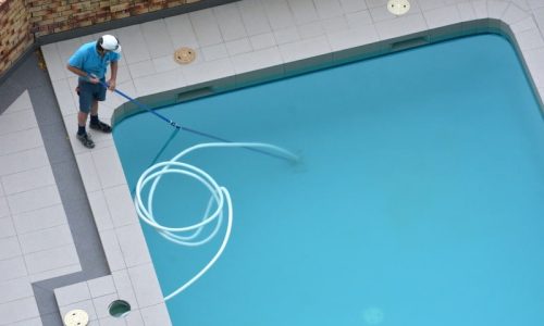 Aerial view of a pool cleaner cleaning a pool in Coolidge